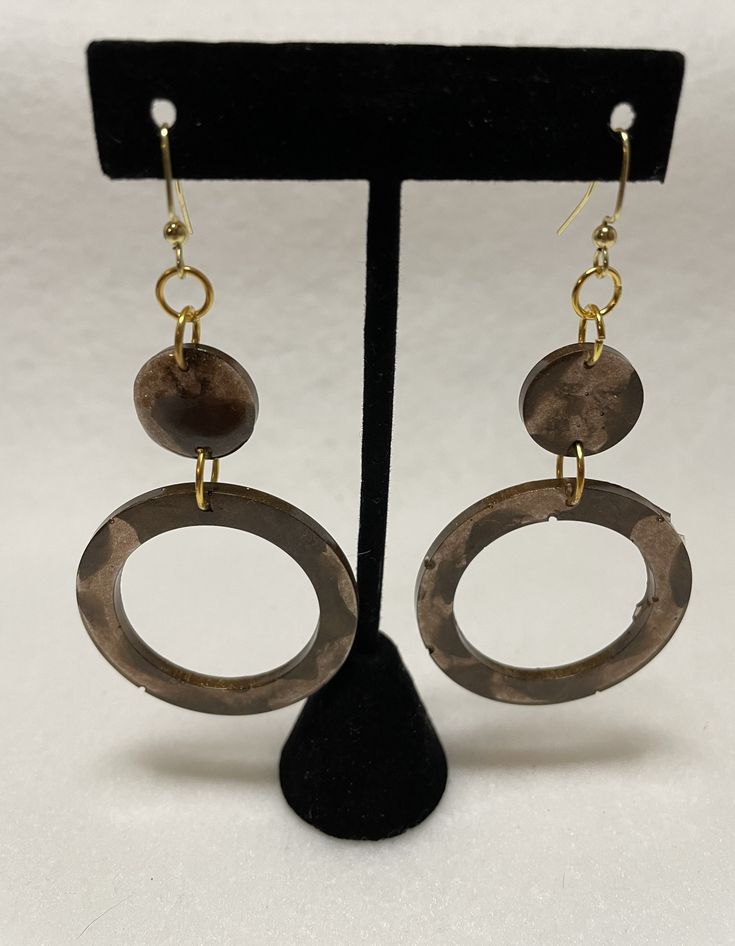 These are beautiful brown statement earrings. They are neutral but not boring and come with gold nickel free fishhook backings that are hypoallergenic. The resin is colored with two shades of brown so they have a marbled effect in the sunlight making them great for day and night wear. They are lightweight as they are made with resin and colored with mica pigment so they have a slight shimmer as well. Brown Brass Drop Earrings, Everyday Brown Metal Earrings, Earthy Brown Copper Earrings, Brown Metal Dangle Earrings, Brown Dangle Metal Earrings, Brown Pierced Metal Earrings, Brown Drop Earrings With Ear Wire, Everyday Brown Metal Jewelry, Earthy Brown Drop Earrings