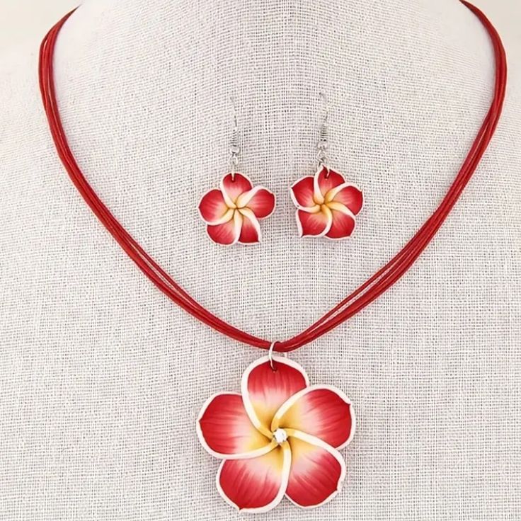 Beautiful Tropical Plumeria Flower Necklace & Dangle Earring Set. Made Of Polymer Clay This Set Gives An Ultra Realistic Look. The Center Of The Plumeria On The Necklace Has A Simulated Diamond Center To Add A Touch Of Brilliance. Necklace Has A Silver Tone Lobster Claw Clasp To Match Silver Tone Dangle Earrings. Approx. 16.75” With 2.5” Extension More Color Options Available See My Other Listings For More Jewelry. Bundle To Save On Shipping. N152 Red Flower Shaped Jewelry For Summer, Red Flower-shaped Jewelry For Summer, Summer Red Flower-shaped Jewelry, Red Flower Jewelry For Summer, Red Flower-shaped Summer Jewelry, Summer Flower Shaped Red Jewelry, Red Summer Necklaces, Red Flower Pendant Jewelry With Flower Charm, Red Flower Pendant Jewelry With Charm