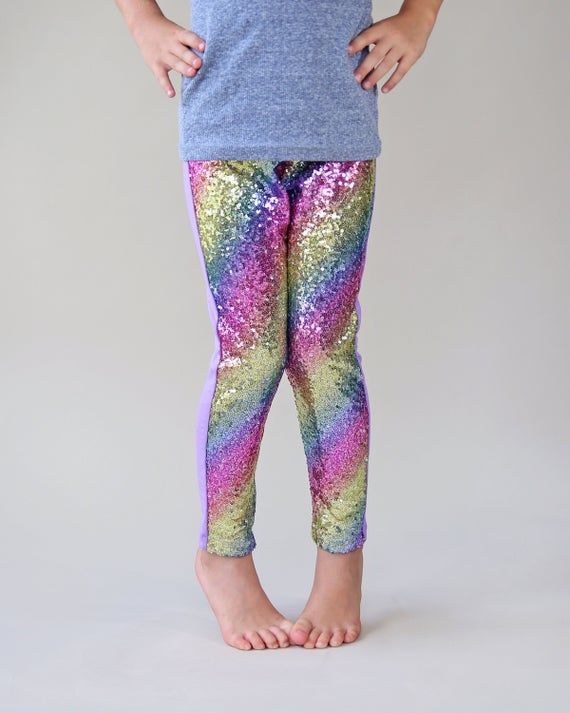 Glitzy, glittering sequins adorn these pants, while lightweight fabric and cotton backing keeps little ones comfy. These glam pants are fun, fashionable and your little lady will love wearing it with its perfect amount of pizazz and sparkle. With the cotton backing, you don't have to worry about wearing out your sequins and your little one can comfortably sit.Pant inseam:3: 13"4: 14"5: 15"6: 16"7: 17"8: 18"10: 19"12: 20"14: 21"Front: 100% polyester Back: 100% cottonWe recommend hand washing and Multicolor Sequined Bottoms For Party Season, Fun Spring Party Bottoms, Fun Fitted Party Bottoms, Pink Stretch Leggings For Party, Stretch Multicolor Party Pants, Multicolor Stretch Pants For Party, Stretch Multicolor Pants For Party, Party Sequin Stretch Leggings, Spring Glitter Stretch Bottoms