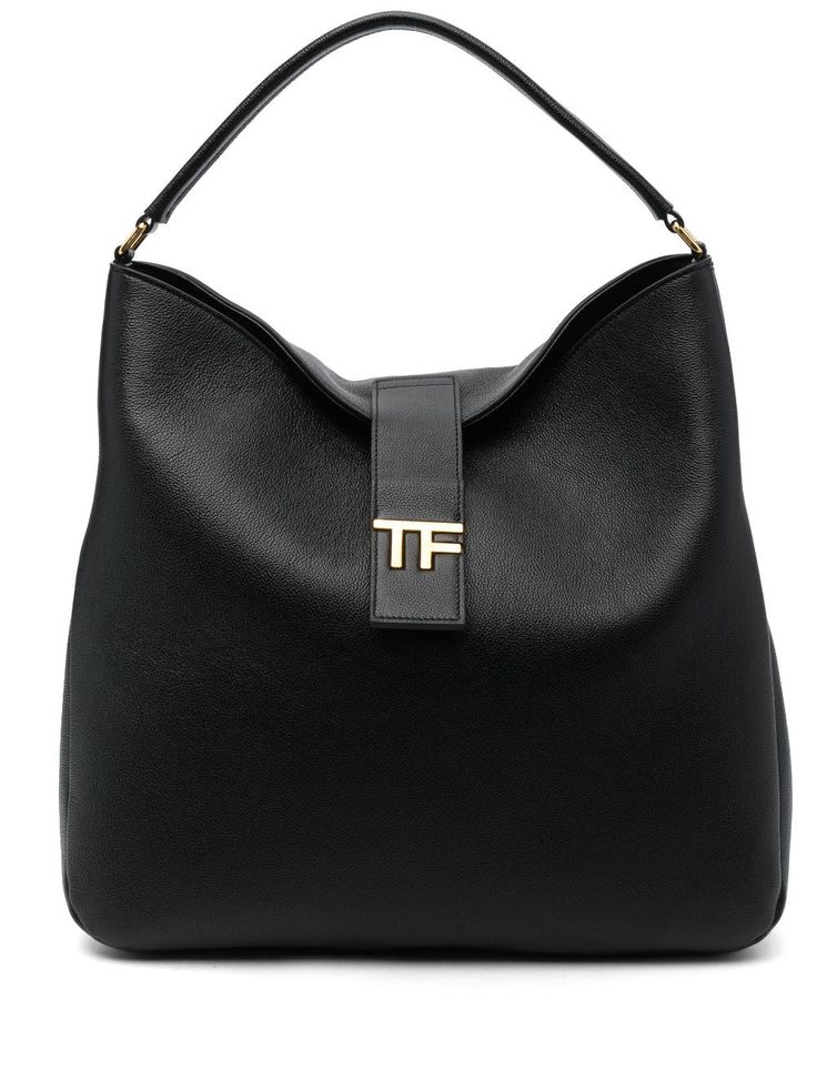 logo-plaque leather tote bag from TOM FORD featuring black, calf leather, grained texture, gold-tone logo plaque, logo stamp to the rear, strap and press-stud fastening, single flat top handle, internal slip pocket and main compartment. Size Info UNI Color Detail Black Made In Italy Material Outer: Calf leather 100% Lining: Polyamide 60% Polyurethane 40% Season One Fall-Winter Season Two Fall-Winter Product bags.. Brand Tom Ford Size And Fit Width 15,75 in / 40 cm Height 14,96 in / 38 cm Depth 3 Everyday Calf Leather Bag With Logo, Chic Business Shoulder Bag With Logo Plaque, Formal Top Handle Shoulder Bag With Logo Plaque, Black Leather Bags With Logo Plaque, Chic Calf Leather Bag With Logo Hardware, Luxury Shoulder Bag With Logo Plaque And Top Handle, Luxury Shoulder Bag With Top Handle And Logo Plaque, Classic Top Handle Bag With Logo Plaque, Chic Travel Shoulder Bag With Gold-tone Logo Plaque