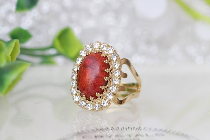 Coral Ring, Natural Orange Coral Stone Ring, gold red Jewelry, Genuine Coral Ring, Vintage Style Ring, and Gemstone Details of item: Metal: 24k gold plated (yellow or rose gold) or silver plated please choose in order Gemstone: coral 10*14 mm of stone and a little clear stones around the coral Adjustable ring The front of stone : 18 mm* 13 mm The ring will be packed in a gift box. Ready to ship 4-5 days, FOR MY CORAL RINGS HERE: https://www.etsy.com/il-en/shop/rebekajewelry?ref=hdr_shop_menu&amp Red Oval Stone Ring, Gold Oval Crystal Ring With Stones, Coral Stone Ring, Red Ruby Earrings, Blue Bridal Earrings, Climbing Earrings, Red Gemstone Ring, Ear Crawler Earrings, Formal Jewelry