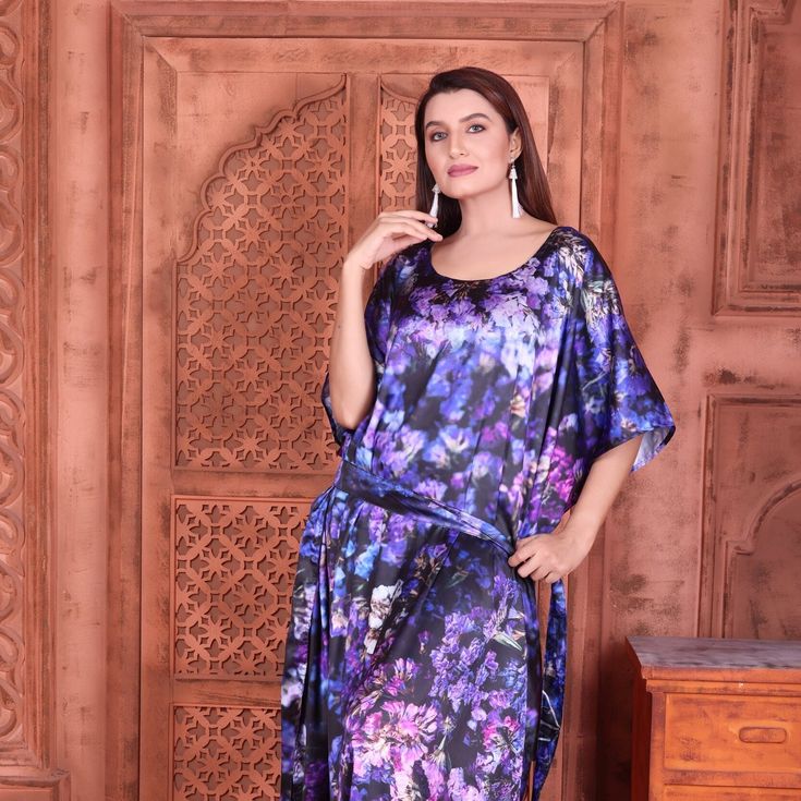 "silk kaftan with floral print of aromatic and colorful flowers designed all over it. Beautifying loose fit kaftan is customized for more elementary look. This self print kaftan with beads is comfy to wear on occasions as well as formal meets. Pairing it with sophisticated accessories modifies trendy style. ONE SIZE FIT ALL -Matching belt to tie up style (belt can be removed while washing) KAFTAN ( Small to 8XL) Regular Kaftan Length 60\" Fabric: Silk satin (NON SHEER) the fabric of kaftan is si Floor-length Floral Print Kaftan For Eid, Eid Floral Print Floor-length Kaftan, Multicolor Floral Print Kaftan For Eid, Eid Multicolor Floral Print Kaftan, Floral Print Maxi Kaftan For Eid, Floral Print Long Kaftan In Free Size, Floral Print Long Kaftan Free Size, Floral Print Long Free-size Kaftan, Long Floral Print Free Size Kaftan