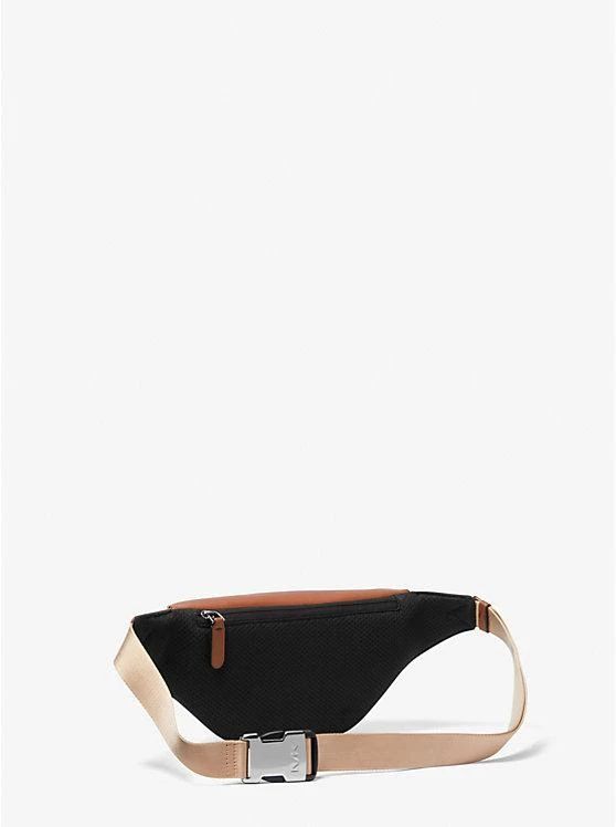 The Varick belt bag is a perfect on-the-go accessory when you need easy access to a few essentials. Made from smooth leather, it features a compact, logo-lined interior and an adjustable buckle-fastened strap. Carry yours over one shoulder or around your waist, depending on your mood..• 100% leather from tanneries meeting the highest standards of environmental performance.• Belt bag.• Leather.• 100% leather.• Gunmetal hardware.• 15.35”W X 5.51”H X 3.34”D.• Lining: 100% polyester.• Zip fastening. Classic Business Bags With Logo Strap, Functional Leather Belt Bag For On-the-go, Casual Michael Kors Bag For On-the-go, Everyday Leather Bag With Logo Strap, Modern Michael Kors Bag With Leather Trim, Modern Bags With Logo Strap For Everyday Use, Modern Everyday Bag With Logo Strap, Modern Everyday Bags With Logo Strap, Modern Bags With Logo Strap For Daily Use