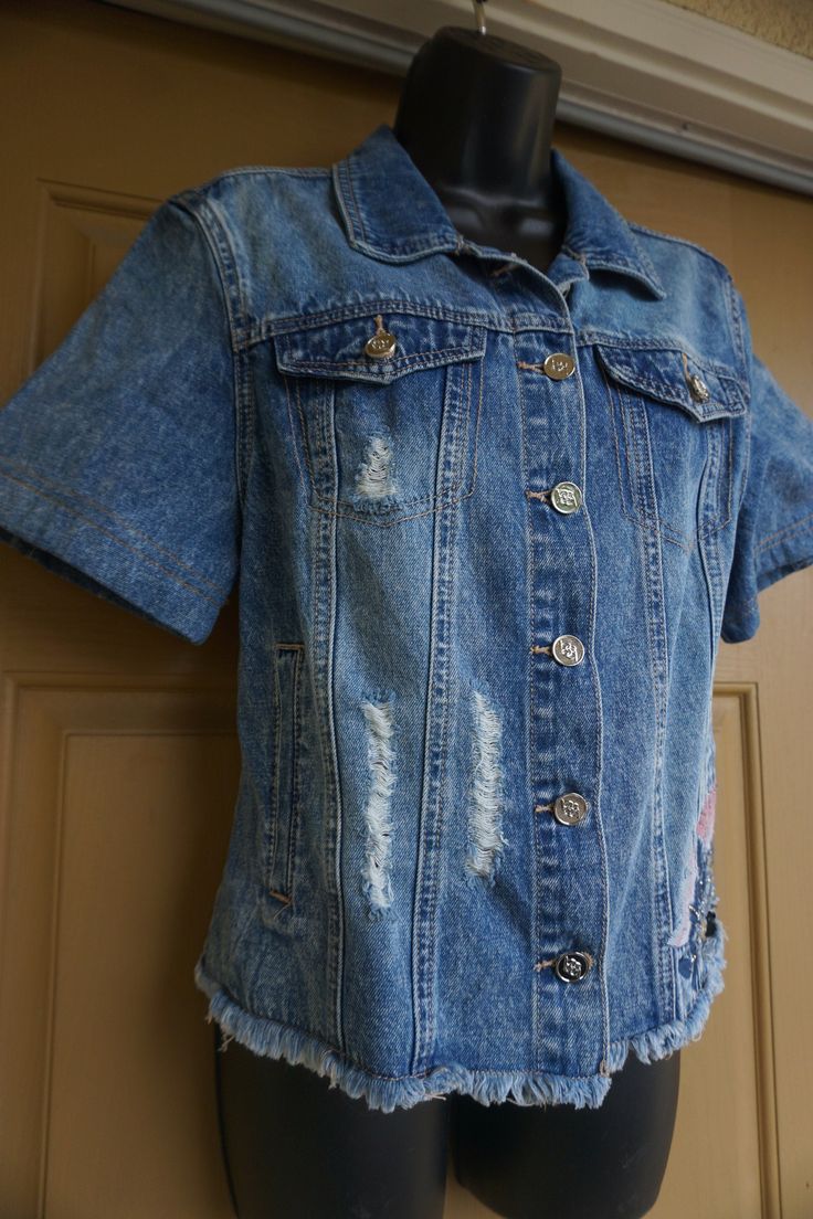 "Embroidered blue denim shirt by bebe. In great condition. Labeled size M - please see measurements. Measurements taken across front laid flat 19\" armpit to armpit 19\" across front of waist 22\" length in front" Fitted Denim Short Sleeve Top, Fitted Denim Top With Short Sleeves, Short Sleeve Dark Wash Denim Jacket For Spring, Short Sleeve Dark Wash Denim Jacket, Dark Wash Short Sleeve Denim Jacket For Spring, Fitted Dark Wash Short Sleeve Tops, Spring Denim Short Sleeve Top, Spring Dark Wash Denim Jacket With Short Sleeves, Summer Short Sleeve Denim Top