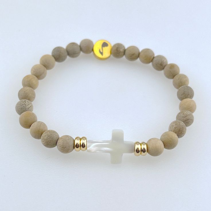 🤍 A Thoughtful Gift: Share the gift of serenity with a loved one. The Serenity Bracelet makes for a meaningful and cherished present. 🌿 Handcrafted Excellence: Each bracelet is carefully handcrafted with silkwood mala meditative beads, along with a beautiful Mother of Pearl cross bead, to ensure a unique piece that stands out with both simplicity and sophistication. ✝️Embrace Your Faith: Wear the Serenity Bracelet as a personal expression of your faith. Let it serve as a source of strength and Spiritual Rosary Bracelet With 8mm Beads For Everyday, Everyday Spiritual Rosary Bracelet With 8mm Beads, Spiritual Everyday Rosary Bracelet With Round Beads, Holistic Wooden Beads Bracelets For Meditation, Natural Wooden Beads Spiritual Bracelet, Spiritual Rosary Bracelet With Wooden Beads, Spiritual Rosary Bracelet With Natural Stones For Meditation, Spiritual Stretch Bracelet With Wooden Beads For Meditation, Spiritual Stretch Bracelet With Wooden Beads For Everyday