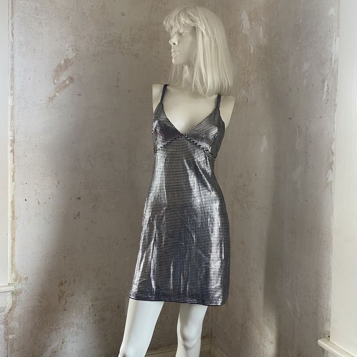 "Amazing Paco Rabanne Silver Mini Dress  Worn in the 1990s by Kate Moss In great vintage condition  There is a tiny bit of stretch  Fully lined. Tag reads size 36-- Measurements taken laying flat: 33\" total length from top of straps to bottom 12\" wide under bustline Ask any questions!" Lined Knee-length Fitted Slip Dress, Fitted Knee-length Lined Slip Dress, Knee-length Fitted Lined Slip Dress, Vintage Fitted V-neck Slip Dress, Glamorous Fitted Slip Dress For Night Out, Glamorous Fitted Silk Mini Dress, Fitted Silk Mini Dress With V-neck, Fitted Silk V-neck Mini Dress, Fitted V-neck Slip Dress For Cocktail