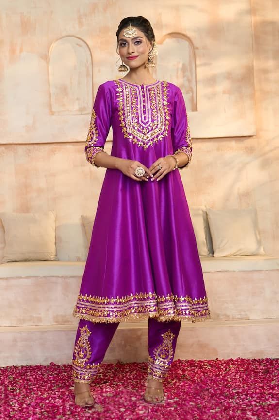 Purple anarkali in dupion base with floral pattern gota embroidered yoke, cuffs, hem and fringed lace details. Comes with matching dupion salwar and dupatta. - Aza Fashions Festive Silk Churidar With Dabka Work, Festive Purple Salwar Kameez For Reception, Festive Silk Churidar For Transitional Season, Silk Anarkali Kurta With Zari Work, Anarkali Silk Kurta With Zari Work, Designer Bollywood Silk Churidar, Bollywood Silk Churidar For Designer Wear, Bollywood Designer Silk Churidar, Silk Churidar For Eid Festival