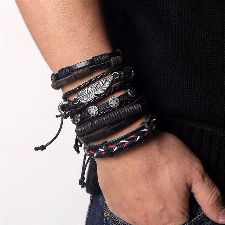 5 Pcs Set Punk Rock Feather Leather Braided Rope Bracelets Layer This Set Of Black Leather Bracelets For A Unique Look. Each Bracelet Is Different, But They All Compliment Each Other. Whether You Are Wearing One Or All Five, It’s An Awesome Way To Pull Together An Edgy Look! The Black Leather Straps Have 5 Different Looks. Two Are Multilayered With A Thick Black Leather Strap Down The Center And Braided Black Chording On The Outer Edges. One Is Studded With Gunmetal Stars, And One Has A Large Gu Bohemian Twist, Braided Rope Bracelet, Leather Charm Bracelets, Estilo Rock, Leaf Bracelet, Bracelets Set, Mens Leather Bracelet, Men Jewelry, Leather Bracelets