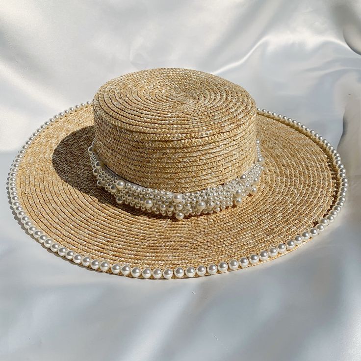 Handwoven straw hat with pearl trim detailing Band at centre of hat is removable Circumference 56-59cm (can be adjusted slightly with inner drawstring) Brim 10cm Made in UK Woman owned small business  Handmade Elegant Adjustable Braided Hat, Elegant Handmade Fedora Straw Hat, Elegant Brimmed Straw Hat Made Of Paper Straw, Elegant Handmade Flat Brim Straw Hat, Elegant Braided Straw Hat For Summer, Elegant Braided Hats For Spring, Elegant Braided Hat For Spring, Elegant Handwoven Boater Hat, Elegant Handwoven Straw Hat With Flat Brim