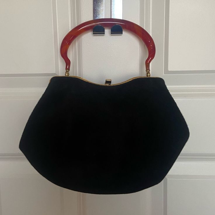 Vintage Never Used Vintage Black Evening Bag With Detachable Strap, Chic Black Evening Bag With Handle Drop, Vintage Black Shoulder Bag With Leather Handles, Black Retro Evening Satchel, Vintage Black Satchel With Leather Handles, Retro Black Clutch Bag, Black Retro Clutch Bag, Black Satchel With Leather Handles For Evening, Black Clutch Evening Bag With Handle Drop