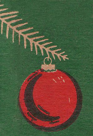 a christmas ornament hanging from the top of a green t - shirt with a fern on it