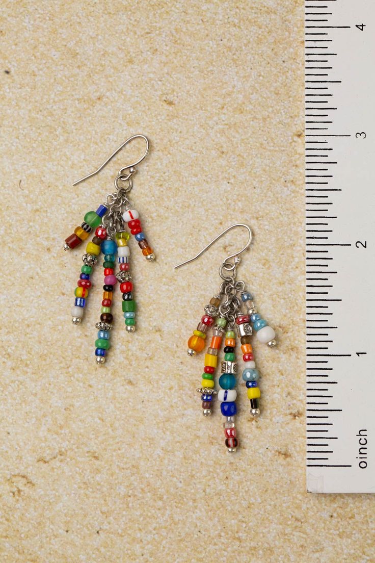 Introducing the United Collection, perfect for festival season! These stunning pieces feature vibrant materials, adding a pop of color that will make you stand out from the crowd. Antique Silver Plated Brass (Lead & Nickel Free) African Trade Beads 2.75" with sterling silver ear wires We hand select our natural materials, thus there may be slight variations in color and/or size that will not detract from the overall aesthetic. Our unique handcrafted designer jewelry for women is made in America, each design created individually in our personal design studio in Floyd, VA USA Vibrant Multicolor Earrings, Multicolor Vibrant Jewelry With Ear Wire, Vibrant Multicolor Jewelry With Ear Wire, Nickel-free Multicolor Jewelry For The Beach, Nickel-free Multicolor Jewelry For Beach, Vibrant Multicolor Dangle Earrings, Bohemian Multicolor Earrings For Beach, Traditional Colorful Beaded Earrings For Festival, Traditional Multicolor Beaded Party Earrings