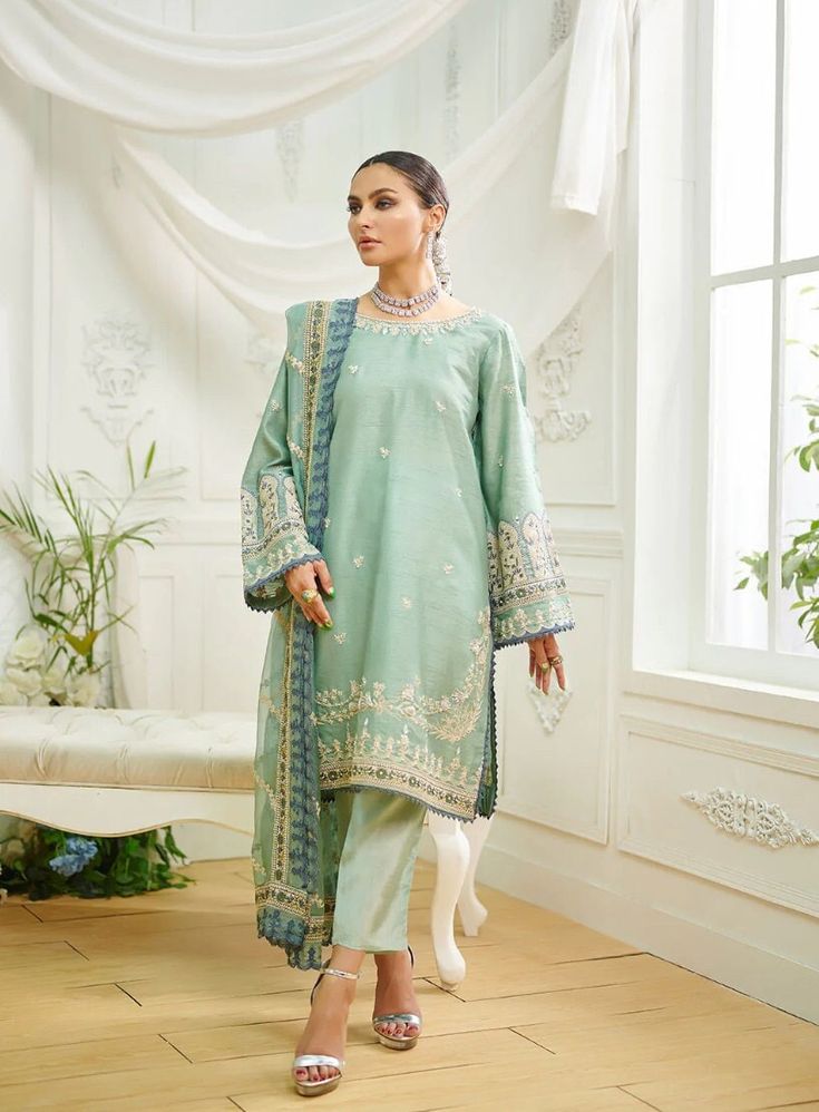 3 Piece Embroidered Suit for Women Description : This three-piece luxury design is crafted on fine fabric featuring alluring embroidery on shirt and dupatta with the look being completed with plain straight pants. Fabric: Cotton Organza Country of Origin : Pakistan General Care Instruction : Hand Wash recommended or dry clean. Color may bleed so please be mindful of other items with it. General Disclaimer   --  Size chart provides reference sizes and actual sizes might be slightly different from the size chart.   --  Actual colors of the outfit may vary from the colors being displayed on the screen Unstitched Cambric Sets With Intricate Embroidery, Eid Cambric Sets With Intricate Embroidery, Designer Wear Mulmul Sets With Resham Embroidery, Designer Mulmul Sets With Resham Embroidery, Designer Unstitched Sets In Chinon, Elegant Cambric Sharara With Zari Work, Elegant Cambric Sharara With Traditional Drape, Unstitched Dabka Work Sets For Eid, Eid Sets In Raw Silk With Resham Embroidery