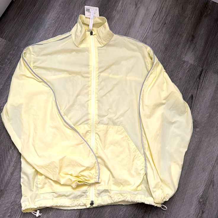 Fabletics Oversized Windbreaker (Light Yellow) This Cinchable, Lightweight Jacket Has An Oversized Fit And Features Reflective Piping. Reflective Silver Piping Fabric: 100% Recycled Nylon Size : Xs (Measurements Are In The Pics) Color: Light Pear/Bright White (Light Yellow) The Stock Photos In The Pink Color Are To Show What It Looks Like On (And I’m Selling The Pink One In Size Small In Another One Of My Listings ) But This Listing Is For The Xs Yellow Jacket. Super Cute, Brand New, Never Worn, Oversized Spring Athleisure Activewear, Spring Oversized Activewear For Workout, Yellow Athleisure Activewear For Light Sports, Casual Yellow Relaxed Fit Outerwear, Yellow Sporty Activewear For Light Sports, Yellow Sporty Activewear For Casual Sports, Spring Sporty Activewear For Light Sports, Sporty Spring Activewear For Light Sports, Spring Sportswear For Light Sports