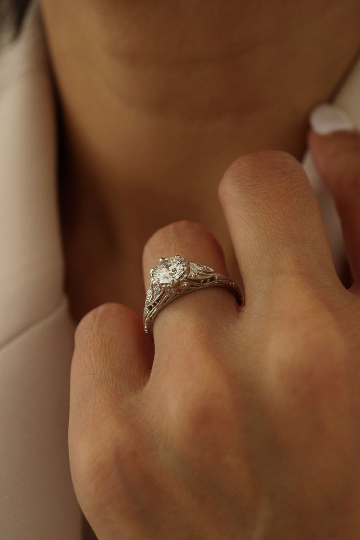 a close up of a person wearing a ring