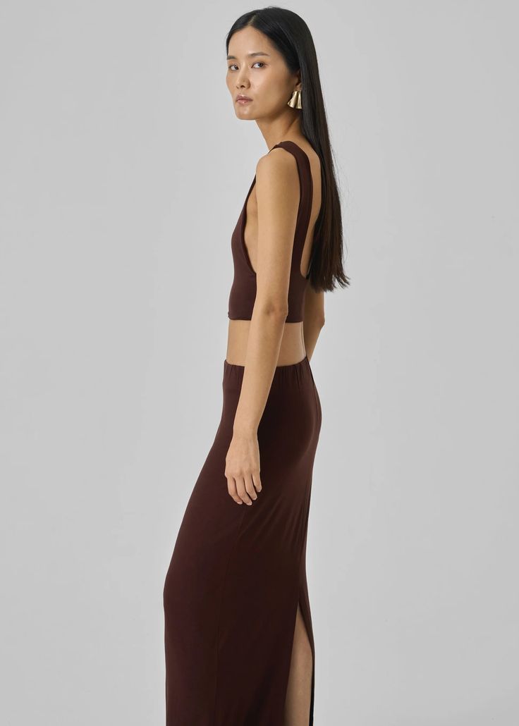 Evangeline Cropped Tank - Brown – The Frankie Shop Chic Sleeveless Elastane Tank Top, Versatile Sleeveless Elastane Crop Top, Sleeveless Brown Seamless Crop Top, Brown Stretch Sleeveless Crop Top, Brown Fitted Cropped Tank Top, Brown Sleeveless Stretch Halter Top, Chic Brown Sleeveless Crop Top, Chic Sleeveless Halter Top, Chic Sleeveless Elastane Halter Top