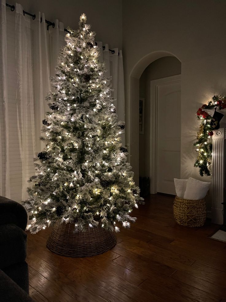 a white christmas tree in a living room