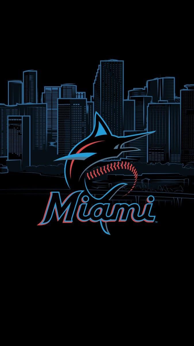 the miami marlins logo in front of a city skyline