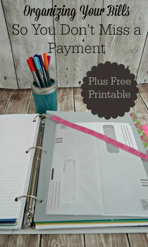 a binder with pens and pencils on it next to an open notebook that says organizing your bills so you don't miss a payment plus free printable