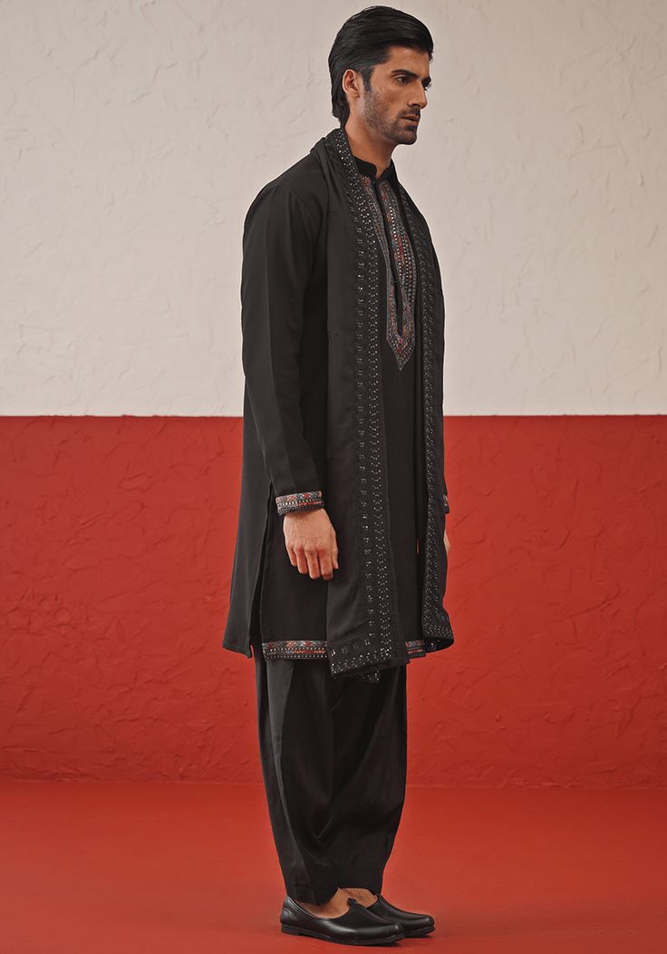 Embrace timeless elegance with Black Kurta. Crafted from luxurious Georgette, the kurta features intricate resham and sequinned embroidery on the yoke, daman, and cuffs. Paired perfectly with matching patiyala pants and an embroidered dupatta. Ideal for Cocktail parties. Composition : Kurta, Patiyala & Dupatta : Viscose Georgette Care: Dry Clean Only and Vacuum Storage This product can be customized for sleeves, length and colour Delivery : 2-4 weeks as the product is hand crafted. Check Size Gu Black Kurta Set, Kurta Set With Dupatta, Black Kurta, Men's Ethnic Wear, Vacuum Storage, Indian Wedding Wear, Embroidered Dupatta, Cocktail Parties, Kurta Set