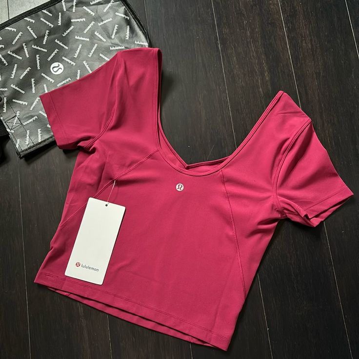 Brand New With Tags Lululemon Align Tee Color Pomegranate (Pome) Sold Out Color Size 6 Guaranteed Authentic 5 Star Rated Seller Next Day Shipping H520 Lulu Lemon Logo Pink, Purple Short Sleeve Activewear For Workout, Casual Purple Tops For Pilates, Purple Athleisure Tops For Pilates, Purple Workout T-shirt, Purple Short Sleeve Top For Workout, Purple Short Sleeve Workout Top, Moisture-wicking Purple Tops For Pilates, Lulu Lemon Tops