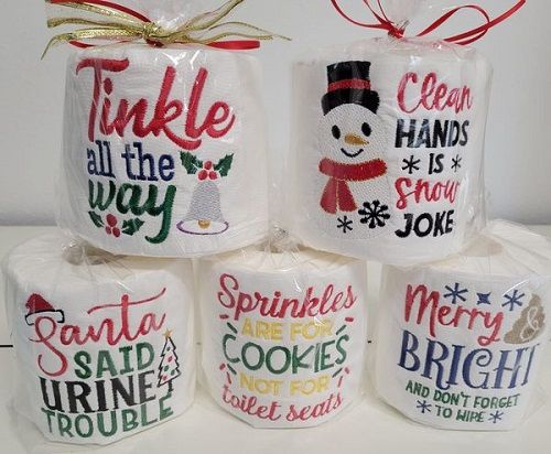 four christmas mugs are stacked on top of each other