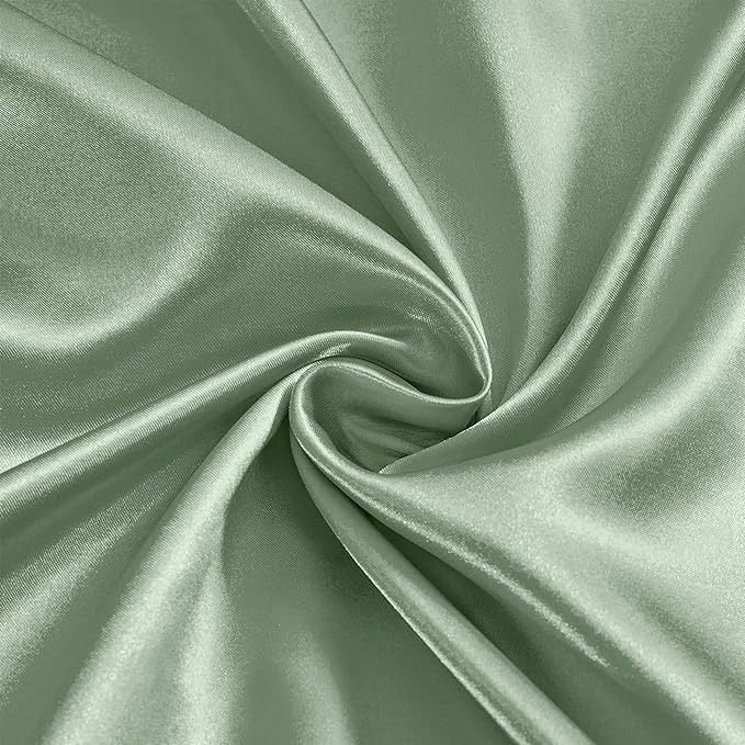 a close up shot of a green satin fabric with very soft folds and smooth lines