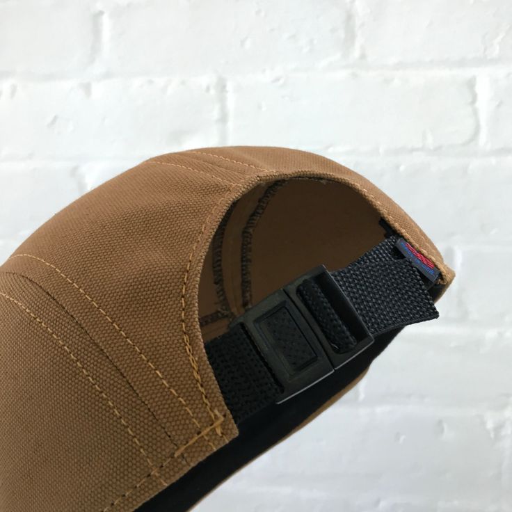 "Handmade cap with pencil holder✏️ ✎DETAILS: 5 panel cap is handmade from 12oz heavy duty caramel duck canvas ( made in USA). Sewn with golden heavy duty top stitch thread. Patch, brim and hardware made in the USA. The brim is not a bought plastic insert. Brims are handmade here in house, they are shorter and softer than typical hats. They are super comfortable yet still completely hand washable and incredible durable. Hand built by two human makers ( apes/April & bird/Rich) with love, care Adjustable Six-panel Canvas Dad Hat, Brown Canvas Baseball Cap, Adjustable 5-panel Canvas Trucker Hat, Adjustable Canvas 5-panel Snapback Hat, Adjustable 5-panel Canvas Snapback Hat, Adjustable Brown Canvas Baseball Cap, Adjustable Canvas 5-panel Trucker Hat, Adjustable Canvas Dad Hat For Everyday, Adjustable Canvas 5-panel Hat