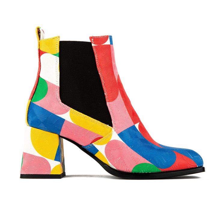 An elevated addition to your shoe collection, the Claudia Mini - Groovy, a women’s designer ankle boot, is the perfect pull-on, heeled women’s ankle boot. Crafted in colorful Italian leather, with a 3" block heel, this style is simple to pull on with its black elastic side inserts and adds an edginess to any look.  This boot has all this season's trendy Boho 60s vibes, including style and comfort. We recommend cleaning our shoes with a soft bristle, horsehair brush or a lint-free cloth. If porti 60s Vibes, Designer Ankle Boots, Heeled Chelsea Boots, Italian Leather Shoes, Boots Uk, Footwear Design Women, Womens Ankle Boots, Heeled Ankle Boots, Womens Heels