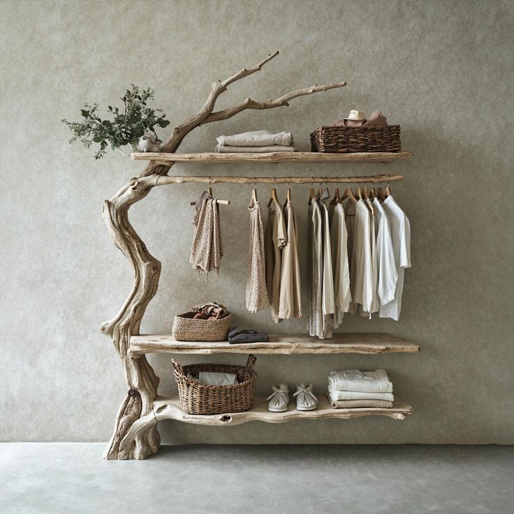 a wooden shelf with clothes hanging on it