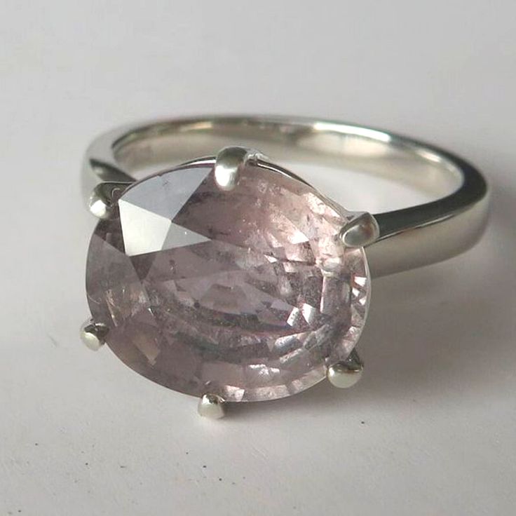 Rare Stunning Large Natural Pink Mauve Grey Blue Color Change Untreated Sapphire In Sterling Silver Ring, 6.71ct. Size 8.25 Absolutely Unique Large Mauve/Grey/Light Blue Natural Untreated Sapphire Is Set In Sterling Silver To Create A Stunning Ring. It Has Color Change Quality (Please See Video For Color Change). This Is A Natural Sapphire (Weight 6.71ct, Clarity Si1 - Inclusions, Size 12.0 X 10.4 X 6.1 Mm, Origin Tanzania, Africa, Untreated - Entirely Natural), The Stone Has Master Oval Cut And Formal Kunzite Ring With Prong Setting, Luxury Silver Morganite Ring, Classic Amethyst Ring With Brilliant Cut In Platinum, Classic Platinum Amethyst Ring With Brilliant Cut, Luxury Silver Sapphire Ring In Platinum, Classic Amethyst Platinum Ring, Modern Silver Sapphire Ring In Platinum, Modern Silver Sapphire Ring In 14k White Gold, Modern Platinum Sapphire Ring In Silver