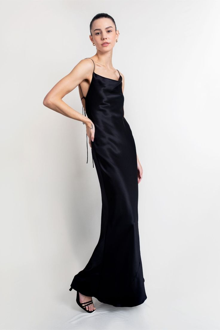 The Whitney gown is striking in its simplicity. Handcrafted from Italian 19 momme silk-satin that's cut on the bias for a flawless drape, it has delicate straps that tie at the low, scooped back and falls to a floor-grazing hem. The draped front neckline elegantly frames the décolletage. This dress is made to order. Please allow 2-3 weeks from order date to shipping date. CARE & INFO Dry clean only 100% silk Made in Canada Bias cut SIZING NOTES Fits true to size, take your usual size Bias cut Ad Silk Slip Dress With Back Opening For Evening, Silk Slip Dress With Cowl Back For Gala, Silk Slip Dress With Low Back And Back Opening, Sleek Gown With Satin Finish For Gala, Sleek Satin Finish Gown For Gala, Silk Satin Dress With Back Opening For Evening, Evening Maxi Dress With Bias Cut And Low Back, Silk Slip Dress With Back Opening For Gala, Formal Silk Satin Dress With Back Opening