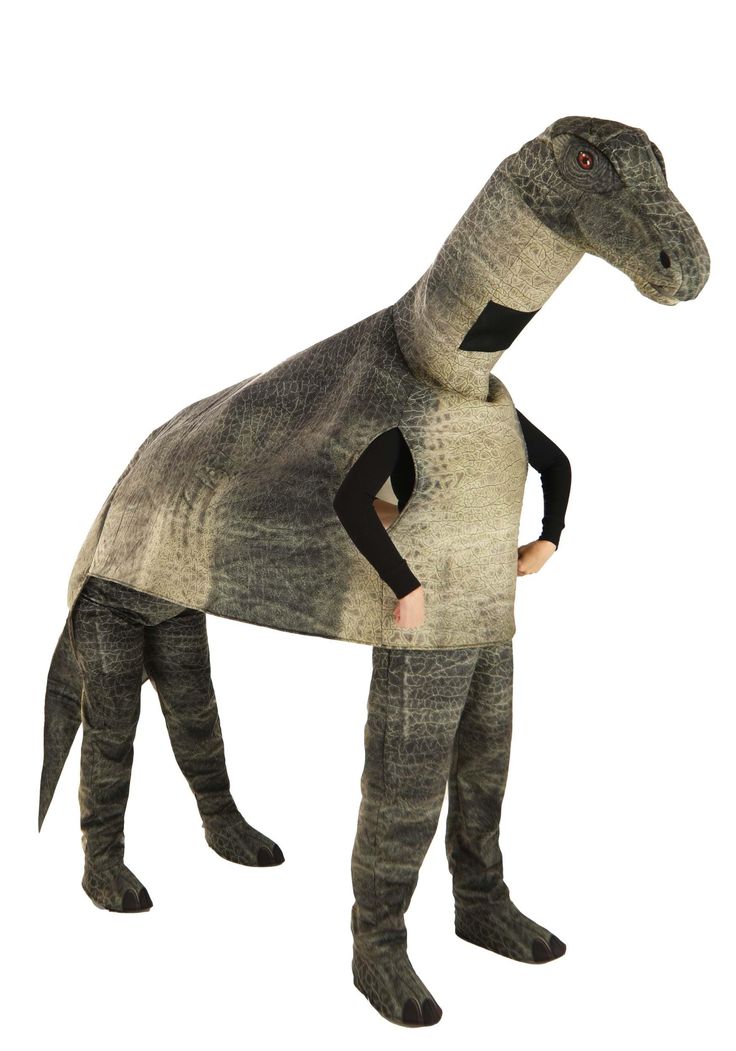 a man in a t - shirt that is wearing a dinosaur costume