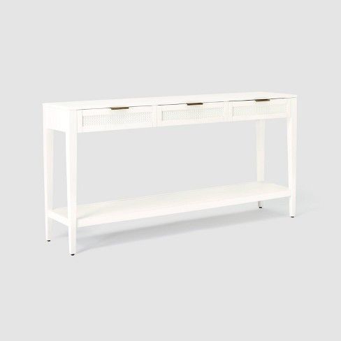 a white console table with two drawers on one side and an open shelf at the top