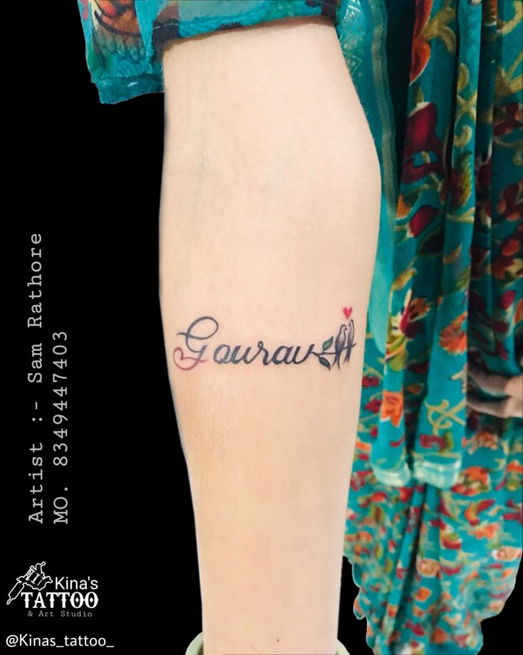 a woman with a tattoo on her leg that says, garrash written in cursive writing