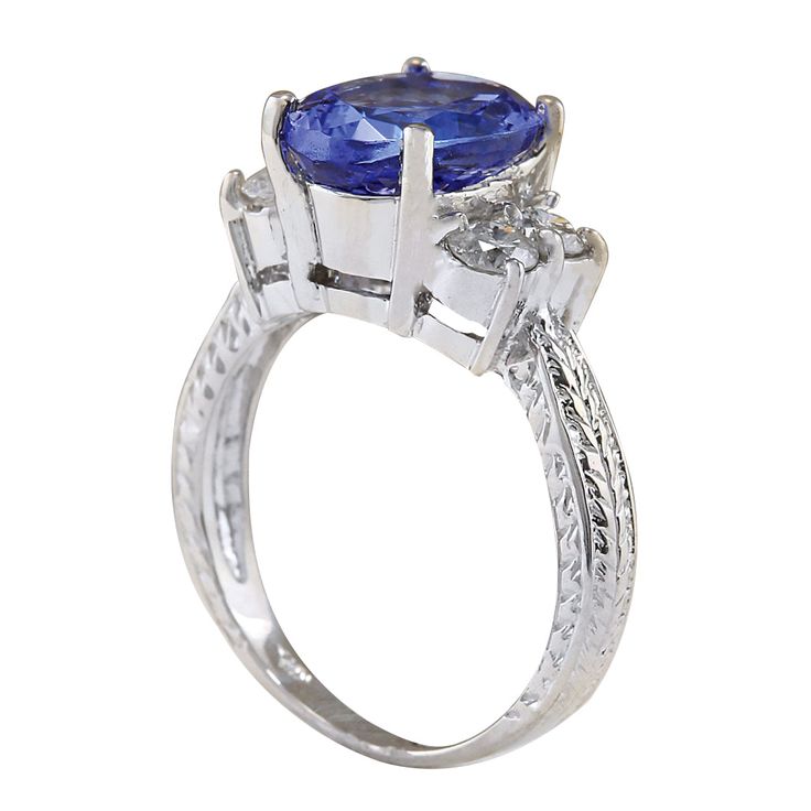 Stamped: 14K White Gold Total Ring Weight: 5.2 Grams Ring Length: N/ARing Width: N/A Gemstone Weight: Total Natural Tanzanite Weight is 3.54 Carat (Measures: 11.10x8.40 mm) Color: Blue Diamond Weight: Total Natural Diamond Weight is 0.65 Carat Quantity: 4 Color: F-G, Clarity: VS2-SI1 Face Measures: 11.10x13.80 mm Sku: [702279W] Fine Jewelry Formal Birthstone Ring With Gemstone, Formal Birthstone Ring With Gemstone, Formal Fine Jewelry Birthstone Ring With Gemstone, Fine Jewelry Tanzanite Three Stone, Exquisite Tanzanite Anniversary Jewelry, Exquisite Tanzanite Jewelry For Anniversary, Elegant Three Stone Birthstone Ring For Formal Occasions, Oval Tanzanite Diamond Ring In White Gold, Tanzanite Three Stone Wedding Jewelry