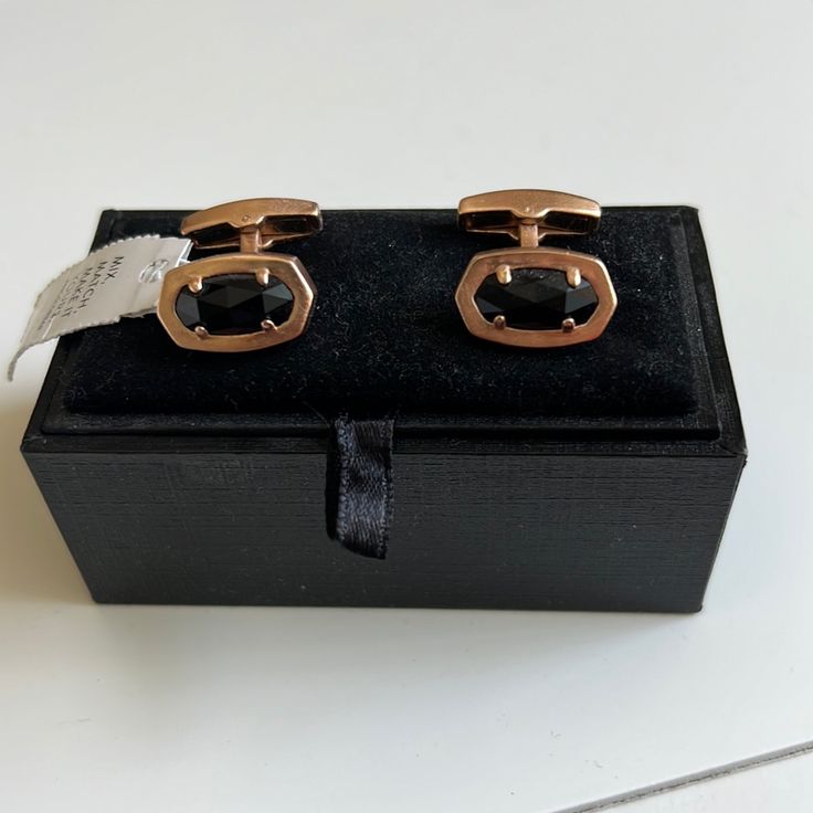 These Cuff Links In Gold And Onyx Are The Finishing Touch Every Suit Needs. Our Signature Kendra Scott Shape Pairs With Sleek, High-Polished Metals To Create An Elevated Accessory That’s Ready To Take Your Formal Looks To The Next Level. New With Tags. Never Worn In The Signature Velvet Box. Would Be A Great Gift. Stone Is 6/8" In Width Designer Cufflinks For Business, Classic Gold Cufflinks For Party, Designer Cuff Jewelry For Formal Occasions, Luxury Black Jewelry For Workwear, Designer Formal Cuff Jewelry, Elegant Adjustable Jewelry For Workwear, Elegant Adjustable Jewelry For Work, Classic Cuff Jewelry For Professional Use, Classic Office Cuff Jewelry