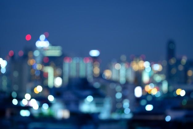 blurry cityscape at night with buildings in the background