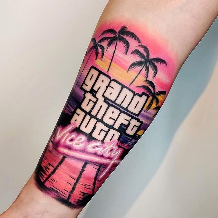 a person with a tattoo on their arm that says grand theft beach and palm trees