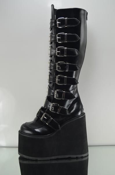 Swing   Black multiple buckle design  Metal tab shin guards on each strap Man Made sole 5.5" platform Full back zipper for easy on/off  women Sizes 6-12 ******Please note******These ship direct from Pleaser and size availability does varyRefund will be issued if your size or color is not availablecontact us with any qu Alt Shoes, Demonia Boots, Alternative Shoes, Demonia Shoes, Gothic Shoes, Shin Guards, Chunky Shoes, Goth Punk, Knee Boot