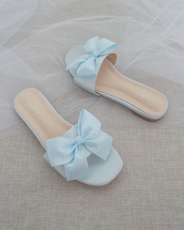 Classic slide flat sandals for casual and dressy look with added SATIN BOW. Simple and easy wear for brides, bridesmaids and wedding parties.DETAILS:COLORS AVAILABLE: Ivory, Light Blue, White, Pink, and ChampagneUPPER: Synthetic upper and liningMATERIALS: Mandmade outsole STYLE NAME: EVELYN Best Shoes For Women, Bridesmaid Sandals, Aesthetic Views, Blue Slippers, Pretty Sandals, Dr Shoes, Bridal Sandals, Fashion Slippers, Best Shoes