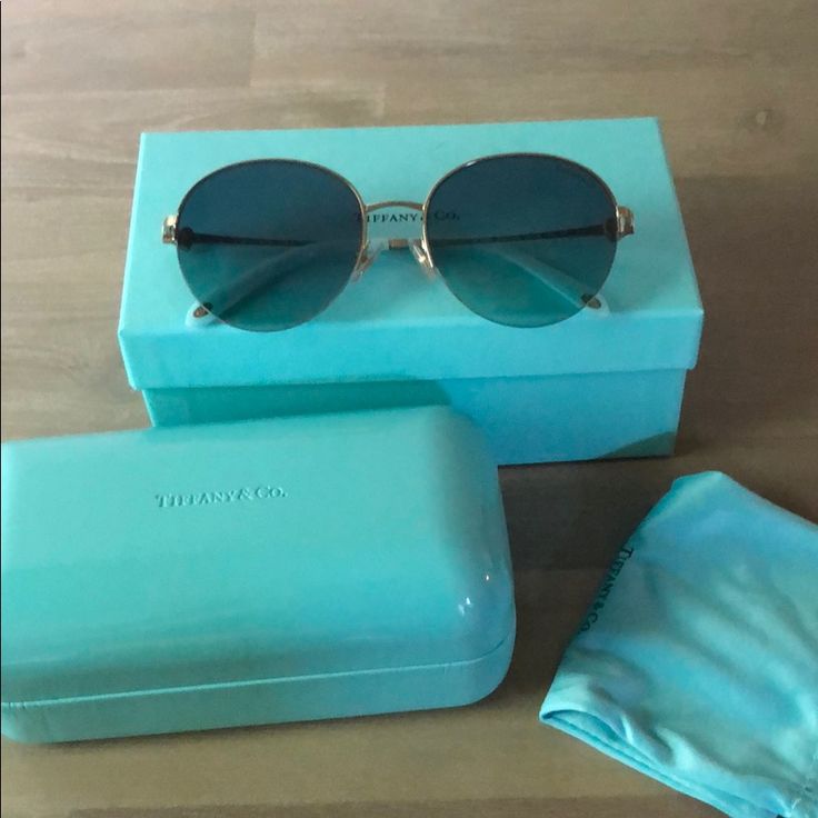 Tiffany & Co Sunglasses. Used Few Times, Comes With Sunglasses Case, Original Tiffany & Co Bag, The Eyeglass Cleaning Cloth And These Bag That Came With The Sunglasses. No Scratches On Sunglasses So Practically Brand New. The Sunglasses Does Have A Tiffany Blue Tint To It Even Tho It Looks Dark In The Photo, Please Make A Note Of That When Purchasing. Elegant Glass Aviator Sunglasses With Tinted Lenses, Elegant Glass Aviator Sunglasses With Polarized Lenses, Elegant Glass Aviator Sunglasses With Uv Protection, Elegant Aviator Sunglasses With Uv Protection, Elegant Glass Aviator Sunglasses, Formal Blue Sunglasses With Tinted Lenses, Chic Blue Sunglasses For Formal Occasions, Formal Blue Tinted Sunglasses, Elegant Glass Aviator Sunglasses For Formal Occasions