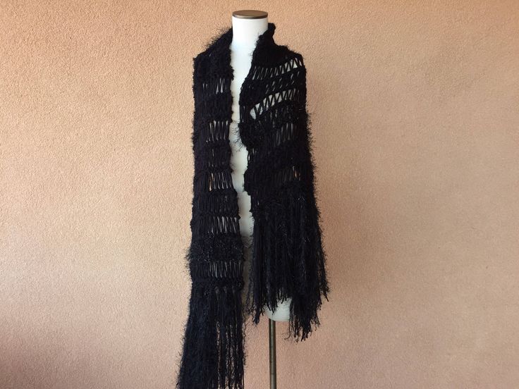 "I designed and hand knit this warm, black shoulder wrap shawl \"Maxi Scarf\" using a few of the very same yarns that I used when I made Stevie Nicks' black and silver Rhiannon shawl. Here is more info about Stevie's Rhiannon shawl and a chance to order one like it from me: https://www.etsy.com/listing/79939861/by-stevie-nicks-designer-clothing-gift This time, though, I started with two strands of thick, warm, sweater-like, colorfast black yarn. Then I accented the body of the piece with texture Black Bohemian Wraps For Winter, Bohemian Black Winter Wrap, Winter Bohemian Black Wrap, Black Bohemian Wraps One Size, One Size Black Bohemian Wrap, Black One Size Bohemian Wrap, Bohemian Black Wrap One Size, Black Shawl Wrap For Winter, Black Winter Shawl Wrap