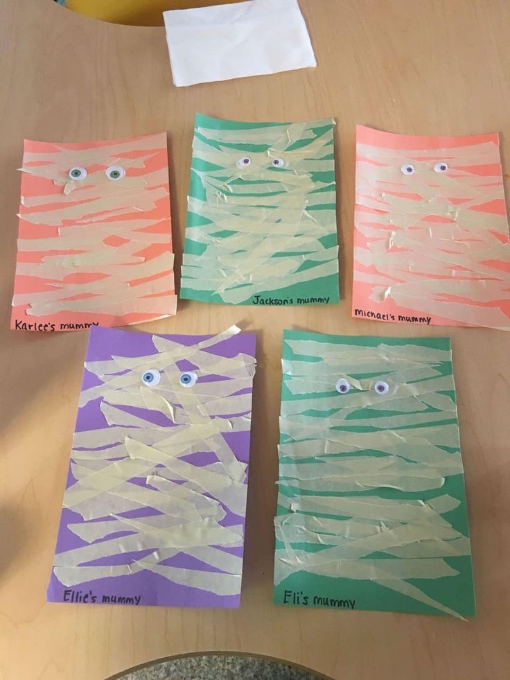 four pieces of paper that have been made to look like the faces of two cats