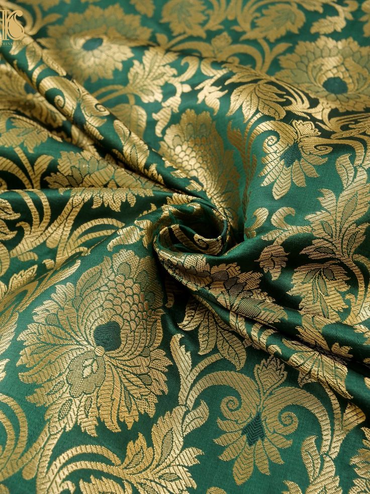 a green and gold brocaded fabric