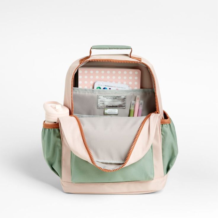 A backpack that's extra comfy and ready to handle all the adventures of the day. Combining colorblocks of candyfloss pink and mint green with pops of coral trim, the kids' medium knapsack is constructed of supremely durable polyester made from recycled water bottles. A roomy interior holds everything your kid needs-books, school supplies, extra layers-and there's a padded pocket to keep their tablet protected. Outside pockets hold snacks, water bottles and more. Pair this book bag with the match Playful Pink Backpack, Playful Pink Standard Backpack, Cute Pink Backpack For Outdoor Activities, Playful Pink Backpack With Zipper Closure, Preppy Pink Backpack For School, Pink Preppy Backpack For School, Green Preppy School Bag, Playful Pink Backpack For Everyday Use, Playful Backpack For Everyday Use