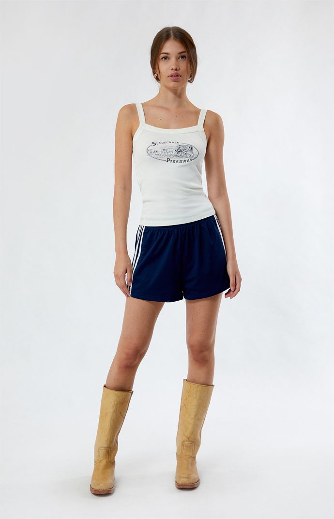 Elevate your summer style with the Stagecoach Provisions Tank Top from PS / LA. Crafted for comfort and style, this tank features a regular fit and a unique graphic inspired by vintage stagecoaches. Whether you're hitting the beach or exploring the city streets, this tank is perfect for adding a touch of laid-back charm to any outfit.


	Solid color tank top
	Scoop neckline
	Fixed straps
	Front graphic
	Regular fit
	Fitted
	100% cotton
	Machine washable
	Model is wearing a size small
	Model measurements: 5’8.5” height, 31.5” bust, 24” waist, 35.5” hips Summer Tank Top For Leisure, Summer Leisure Tank Top, Spring Leisure Tank Top, Sporty Graphic Print Tank Top For Spring, Sporty Spring Tank Top With Graphic Print, Sporty Summer Tops For Leisure, Casual Graphic Print Tank Top, White Sleeveless Tank Top For Leisure, Spring Cotton Tank Top For Leisure