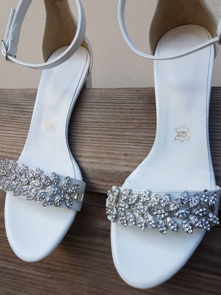 "Bridal pumps white Shoes ideal for your wedding or any event, these bridal shoes are rhinestonew decorated silver crystal and andthat give striking details. Heel Height: 8 cm/3.15\" (pictured) or 5 cm/1.96\" Full sizes only ** If you are unsure of your size, please contact me so I can assist you. ** If you need to have your product by a specific date, contact me and we can discuss express construction options. I would like to help! ★ More Wedding shoes: https://www.etsy.com/listing/751419113/br Wedding Sandals With 4-inch Heel And Round Toe, Open Toe Wedding Shoes With Rhinestones, Low Heel Wedding Shoes With Rhinestones, Ankle Strap Wedding Shoes With Rhinestones, Glamorous Low Heel Wedding Sandals, Glamorous Wedding Sandals With Low Heel, Glamorous Wedding Shoes With Block Heel, Silver Sandals With Heel Strap For Wedding, Elegant Wedding Sandals With Rhinestones