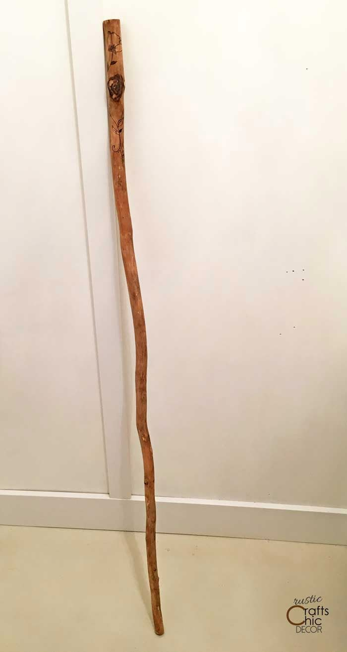 a wooden stick is leaning against the wall