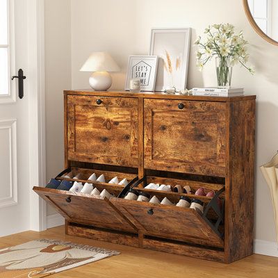 a wooden cabinet with two open drawers